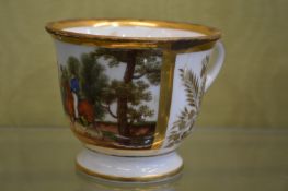 A French porcelain cup decorated with figures on horseback.