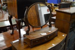 A mahogany bow fronted dressing table mirror.