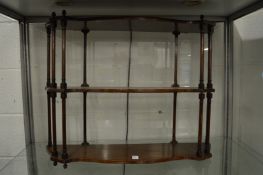 A mahogany wall shelf.