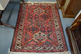 A small Persian rug.
