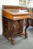 A Victorian walnut Davenport.