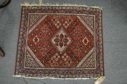 A small Persian rug.