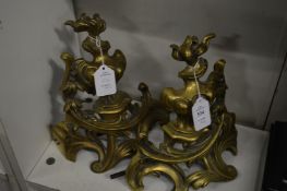 A pair of brass chenets.