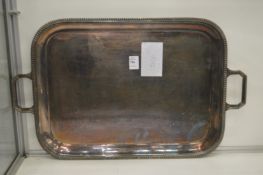 A plated twin handled tray.