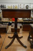 A 19th century mahogany pedestal occasional table with a drawer to one end.