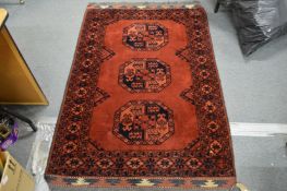 A Bokhara style Persian rug.