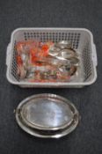 A plated entree dish and cover and a quantity of plated flatware.