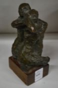 A small abstract bronze of lovers.