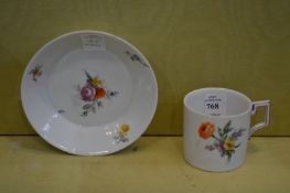 A Berlin floral decorated cup and saucer.