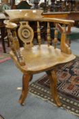 A 19th century elm spindle back revolving desk chair.