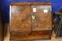 A Victorian walnut table-top writing cabinet.