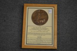 A framed and glazed WW1 bronze memorial death plaque or 