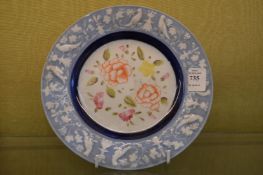 A small Spode plate with moulded rim.