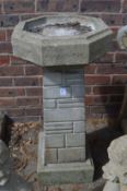 Reconstituted stone bird bath.