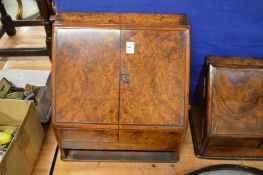 A Victorian walnut table-top writing cabinet (lacking bottom drawer).