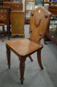 A 19th century mahogany hall chair.