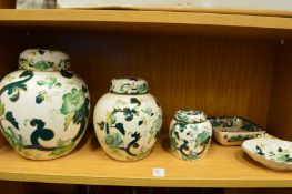 A graduated set of three Masons Chartreuse ginger jars and two other matching items.