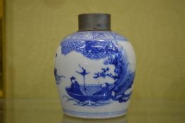 A Chinese blue and white porcelain tea caddy, with pewter cover.