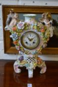 A Dresden porcelain mantle clock.