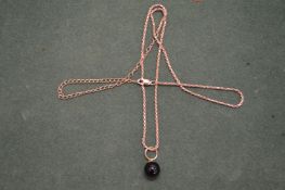 A pendant and chain.