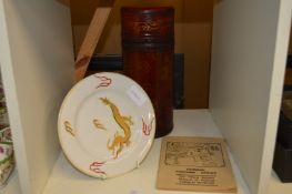 A Chinese fortune sticks game, boxed, and a Chinese plate.