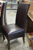 A set of six modern brown leather high back dining chairs.