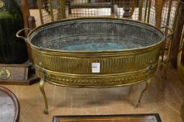 A brass oval jardiniere.
