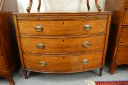 A good George III mahogany bow front chest with brushing slide over three graduated long drawers.