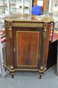 A good 19th century mahogany and ormolu mounted corner encoignure.