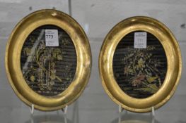 A pair of small oval silkwork pictures.