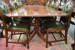 A good George III style mahogany twin pedestal extending dining table with two leaves.