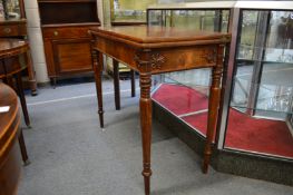 A good mahogany rectangular foldover card table on carved and turned supports.