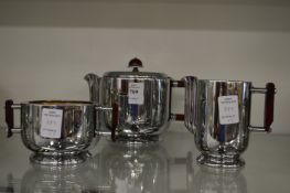 A decorative three piece tea service.