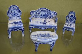 Four pieces of Delft miniature blue and white furniture.