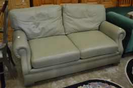 A good pale green leather upholstered two seater bed settee.