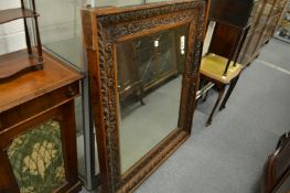 A good large carved oak framed wall mirror.