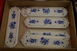 Porcelain door finger plates.