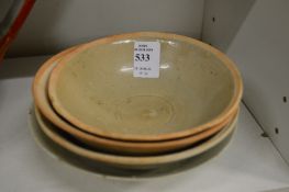 Four small Chinese bowls.