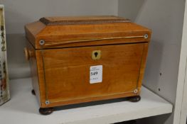 A satinwood tea caddy.