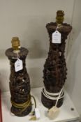 Two pierced and carved Balinese lamp bases.