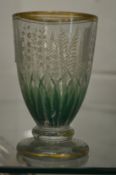 A decorative engraved glass goblet.