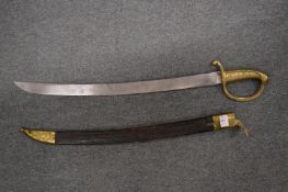 A brass hilted short sword with scabbard.