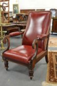 A good 19th century mahogany and red leather cloth upholstered reclining library armchair.