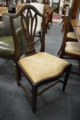 Five mahogany dining chairs.