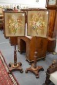 A pair of 19th century mahogany pole screens.