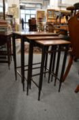 An Edwardian inlaid mahogany nest of tables.