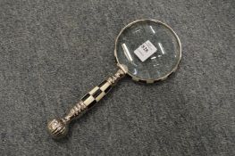A decorative magnifying glass.