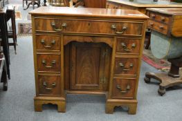 A good George III style mahogany small kneehole desk.