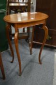 A mahogany occasional table.