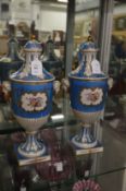 A good pair of Dresden porcelain pedestal vases and covers.